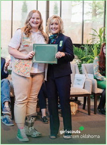 Braylea Lawson accepts the Girl Scouts of Western Oklahoma Scholarship earlier this month.