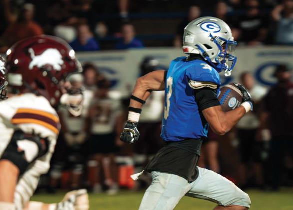 Guthrie’s Codie Carlock (3) runs away from Blanchard defenders on his way to a touchdown at Jelsma Stadium on Friday, Sept. 18. The Bluejays won 49-7. Photo by Reece Heck