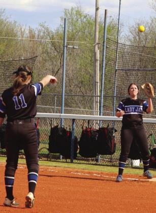 Katelynn Siess throws out Cushing batter with Ashlee eichler making the play at first base.
