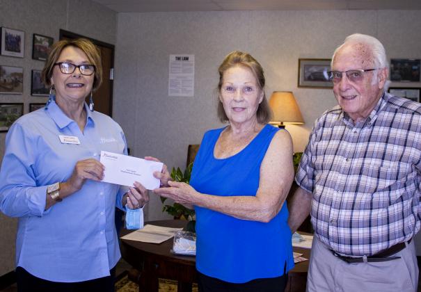 From left to right) Janie Carey, Central Foundation board member presents Neighborhood Solutions Director, Sue DuCharme, and Administrative Coordinator, Bob Cook, with Central Foundation grant.