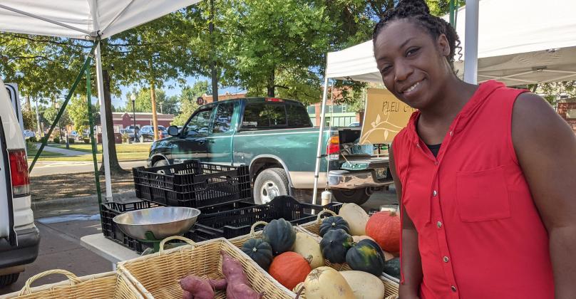 Lacresha Davis looks over the various offerings at her local farmers market in Tulsa.