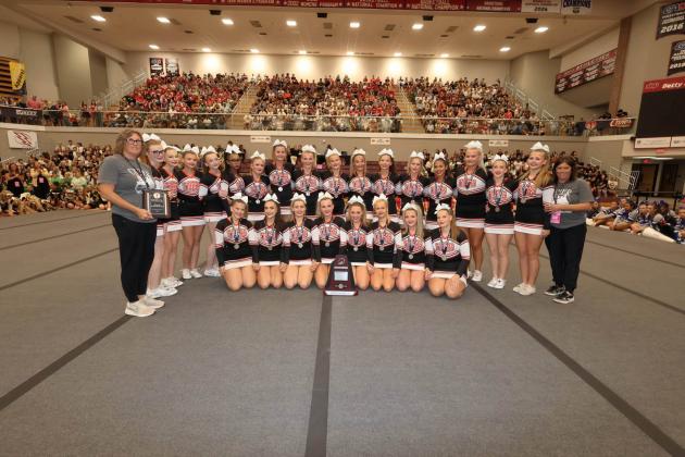 Crescent’s competitive cheer team celebrates after earning the Class 2A state runner-up trophy Saturday at Southern Nazarene University in Bethany. The Lady Tigers scored 250.4 points, finishing just 3.6 points behind state champion Savanna. Photo Courtesy of Emily Williams.