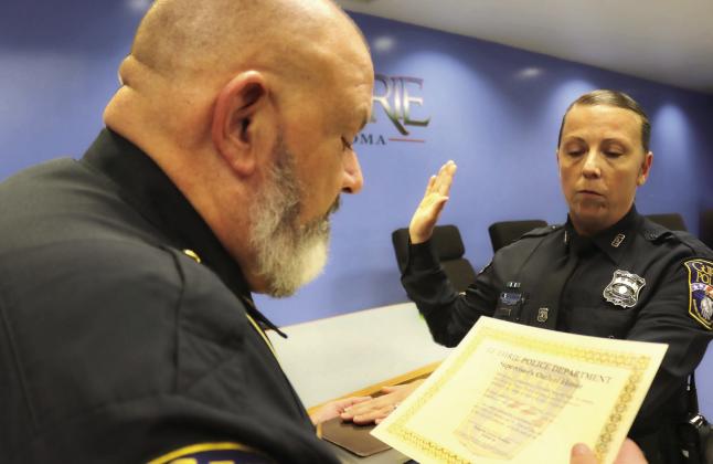 Guthrie Police Chief Sweger recognizes Sergeant Quinlan during a ceremony honoring her promotion Monday, Aug. 31, during the City Council meeting. Photo courtesy of Guthrie Police Department’s Facebook.