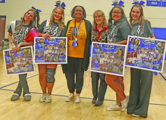 Pictured above: The GHS senior cheerleaders with their coach Pam Johnson-Fields at Senior Night activities on Feb. __. From (L-R) are, Sophia Weiand, Maddie Peterman, Coach Pam Johnson Fields, Lauri Early, Hayleygh Triplett, and Carolina Turchi. Photo by Mike Monahan.