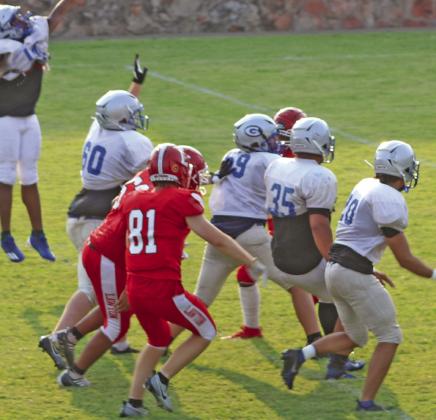 Guthrie defense scrimmages against Lawton offense on August 19.