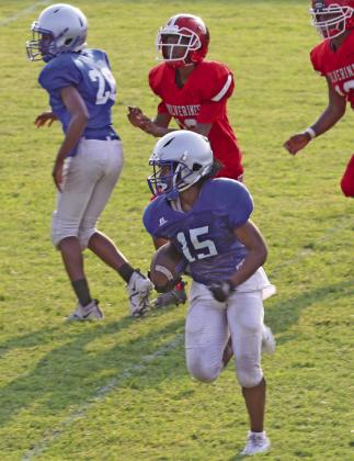 Guthrie #15 breaks loose for a touchdown run against Lawton on August 19.