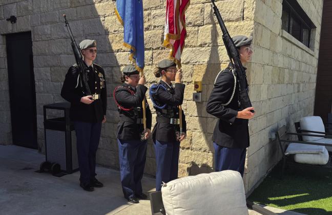 Color Guard members are seniors (from L to R) Garrett Looney, Katherine Espinoza, Monica Lavender and Caden Maurey. Photo by Guthrie JROTC