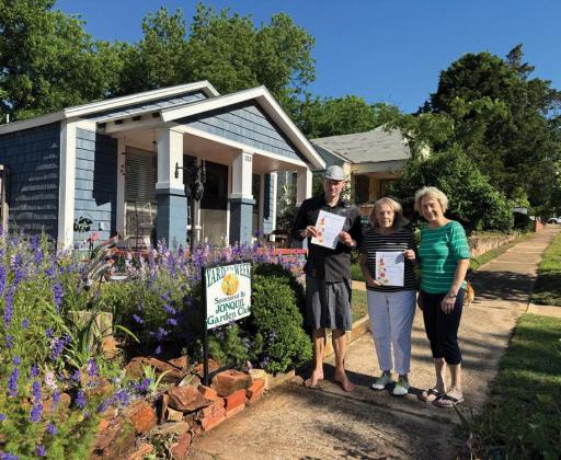 Jonquil Garden Club presented 2 houses yards of the week this week. Pictured is Tim Poindexter, Sue DuCharme and presenting Sue Gentling. Homes are located at 313 and 317 S 2nd. Submitted photo