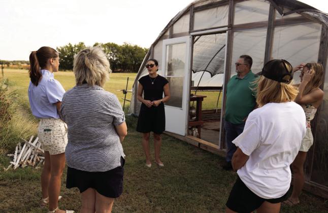 U.S. Rep. Stephanie Bice speaks to Oklahoma flower farm owners about the struggles they face. The farmers talked with Bice about state tax policy and getting the floriculture industry recognized alongside traditional agriculture. Photo by Brent Fuchs.