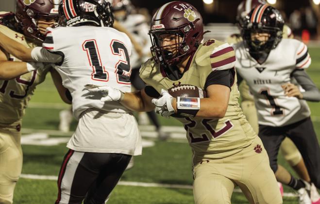 Kiptyn Baker runs with the ball during Cashion’s 54-13 win over Meeker in Cashion, Oklahoma on Friday, Oct. 2. Photo by Brent Fuchs