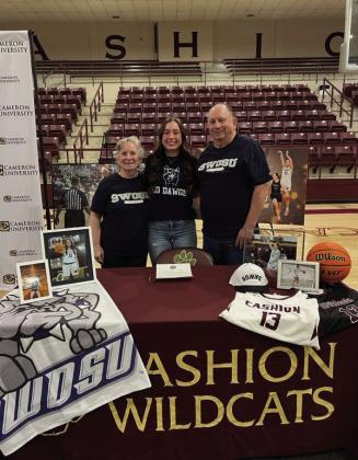 Cashion Wildcats point guard Lauren Jenkins signs with Southwestern Oklahoma State University Women's Basketball team. Jenkins is pictured with her Grandmother Donna Jenkins and Grandfather Larry Jenkins.