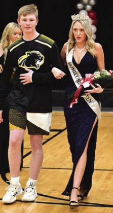 RIGHT: King Willie Schoonover escorts Mulhall-Orlando’s Homecoming Queen Breelyn Kime out of gym in ceremonies on January _. The Panthers would beat Prue ___, and the Lady Panthers lost _-__.