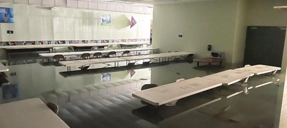 Guthrie Jr. High school cafeteria flooded due to damage from storm.