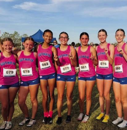The Guthrie Lady Jays cross country team celebrates after capturing first place at last week’s regional competition, earning the regional championship and advancing to the state meet.