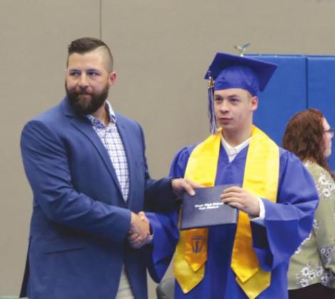 Chad Maker handing out diplomas
