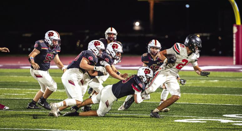 Crescent's Travis Wolfe (2) is brought down by a swarm of Cashion defenders during the Tigers' 37-14 Week 1 loss at Cashion on Friday, Aug. 28. Photo by Reece Heck