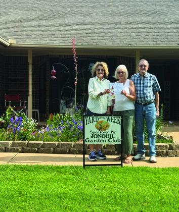 Jonquil Garden Club yard of the week is 410 Lake Road. Pictured is Jennie Woodard, Jonquil Garden Club Member , Jeannette and David Fletcher.