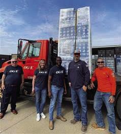 Left to right: OGE employees John Koons, Allison Terrill, Spencer Browne, Kyle Sexton and Victor Terán Jr. prepare to deliver fans to seniors and families with low income. The distribution is part of the electric company’s annual fan donation program.