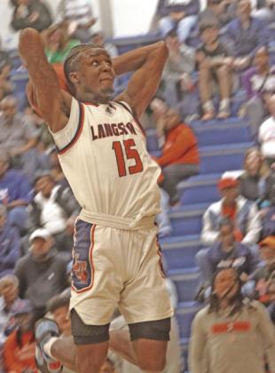 Langston BB Cortez Mosley on way to dunking ball.