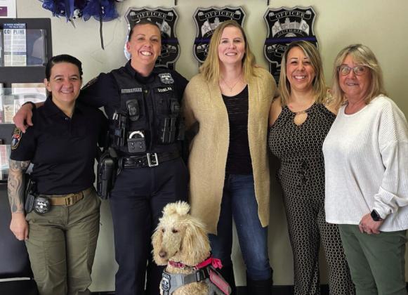 From left to right: Detective Hailey Solomon, Officer Jessica Quinlin, Advocate Patricia Mutters, Communications Officer Brianna Evans, Admin Assistant Shelly Clemons, in front Therapy Advocate Mercy. Submitted by GPD