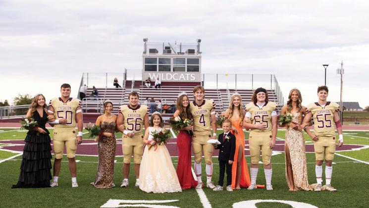 Cashion’s 2026 Homecoming Court stands at midfield before the Wildcats’ Oct. 2 football game against Meeker in Cashion. From left, Gavin Layton and Dylan Ahern; Slade Williams and Madison Lawther; flower girl Julia Kordis; Hank Brown and Caroline Oakley; crown bearer Foster Mounce; Connor Poe and Ruby Hudson; and Asher Gable and Blake Cavner. The homecoming festivities ended with the Wildcats earning a 54-13 win over Meeker. Photo by Brent Fuchs