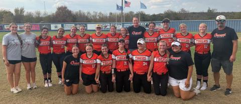 Crescent’s Lady Tigers are all smiles after defeating Hartshorne to earn a berth in the Class 2A state fast-pitch softball tournament. The victory capped a dramatic day for the Tigers, who defeated Hartshorne twice to claim the super-regional championship and advance to the state tournament in Shawnee. Photo by Emily Williams