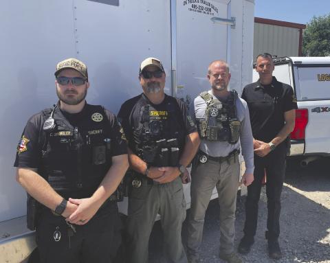 Logan County Sheriff’s Office along with the U.S Marshalls prepare to conduct compliance checks during Operation Adam’s Watch. Deputies visited registered sex offenders throughout the county to verify addresses and ensure required registration information was current. Photo by Nikki Bos
