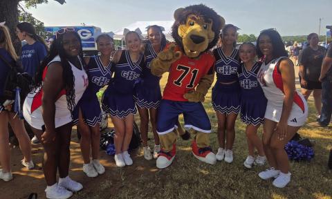 Jay the Lion strikes a pose with Guthrie Cheer members during the annual Back to School Bash on August 8. Photo courtesy of Guthrie Public Schools.