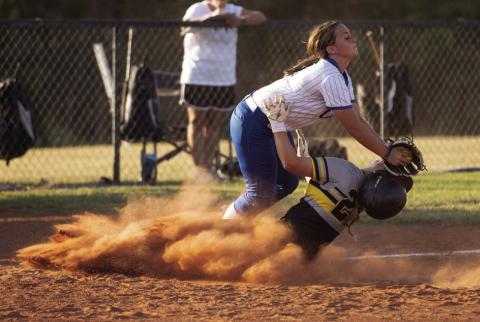 Mulhall-Orlando’s Cassidy Williams, No. 22, makes an aggressive slide into the base as a Coyle defender the tag during the Panthers’ game against Coyle. Photo by Brent Fuchs
