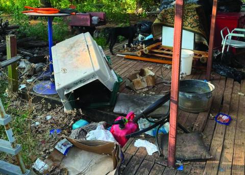 Debris, trash and evidence of severe neglect are visible outside a Logan County residence where investigators are conducting an animal cruelty investigation. Photo courtesy of The Humane Society of Tulsa.