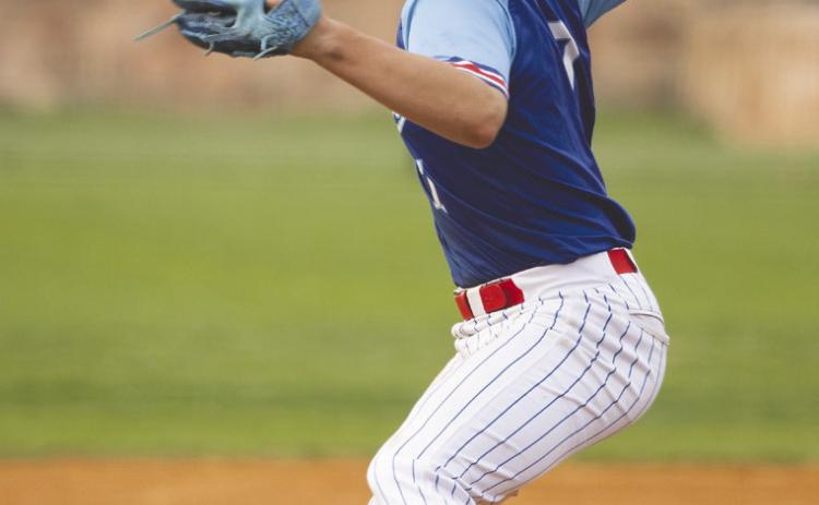Guthrie’s Maddox Vaughn delivers a pitch against Santa Fe South during the March 30 matchup, bringing the heat from the mound as the Bluejays battled on the road. Photo by Brent Fuchs