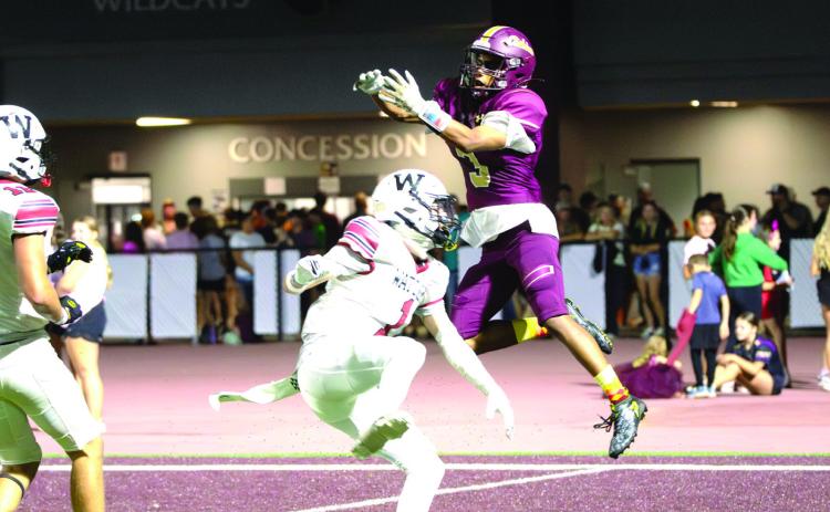 Cashion’s Grayson Davis, who scored a touchdown, hauls in the football in a 42-7 win over Watonga on Friday night.