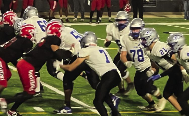 Members of Guthrie’s offense, including seniors Rainwater, Vaughan, Wilder, Creed and Walters, face off against Bishop McGuinness during last Friday's game. Photo Submitted