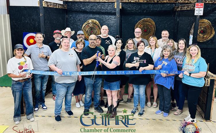 Ribbon Cutting at Dueling Axes. Photo submitted by Heath Shelton of Shelton's Photography