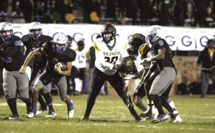 Guthrie's Kolten Carlock breaks away against Lawton MacArthur in the first round of the 2024 Class 5A state playoffs.