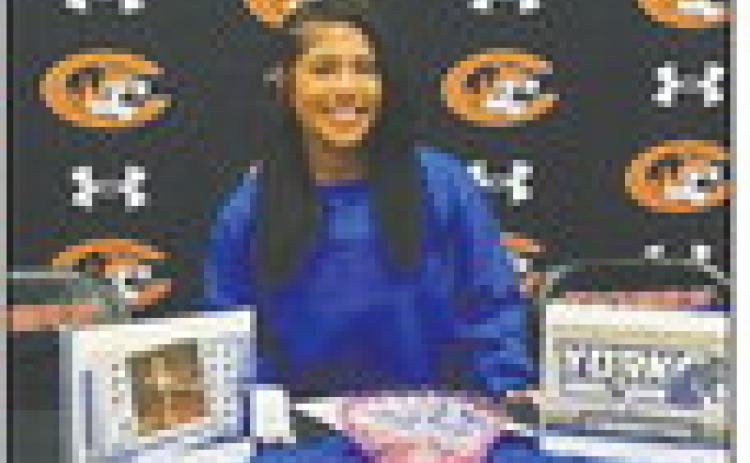 Zori Wilson signs to continue her basketball career at York University on April 13. Photo courtesy of Crescent Girls Basketball Facebook