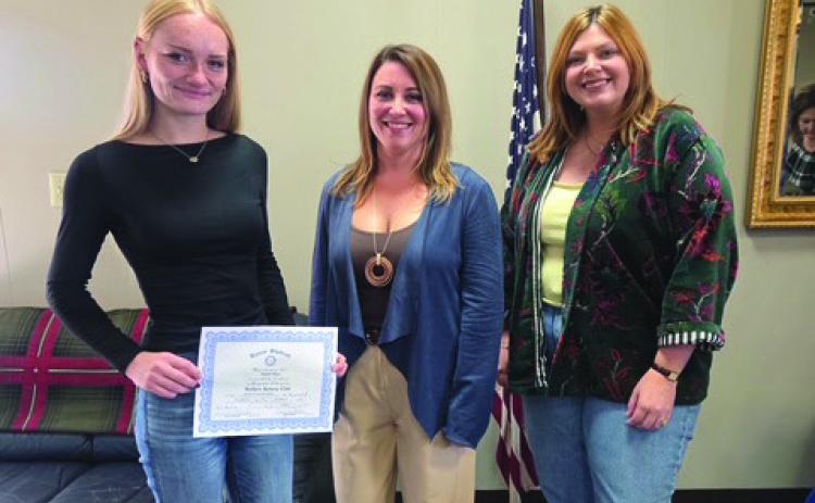 Taylor Mays, Nicole Piersol with Serenity Spa and Rotary President, Coy McPeek.