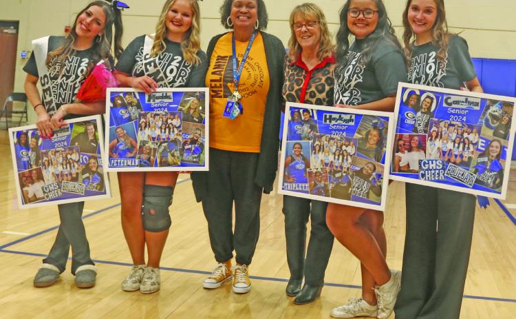 Pictured above: The GHS senior cheerleaders with their coach Pam Johnson-Fields at Senior Night activities on Feb. __. From (L-R) are, Sophia Weiand, Maddie Peterman, Coach Pam Johnson Fields, Lauri Early, Hayleygh Triplett, and Carolina Turchi. Photo by Mike Monahan.