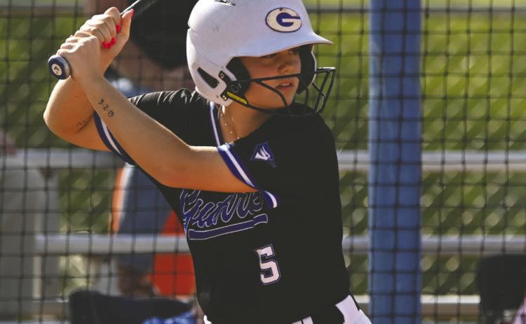 Guthrie’s Saylor Hamilton settles in at the plate, focusing on the pitch during Lady Jays action. Photo by Brett Tennyson