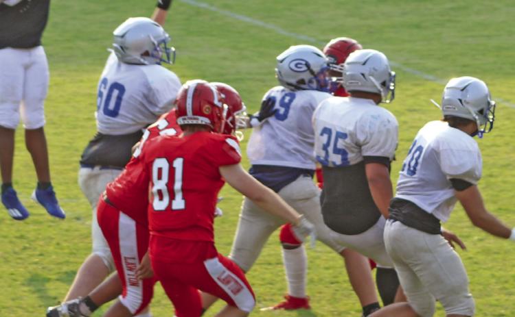 Guthrie defense scrimmages against Lawton offense on August 19.