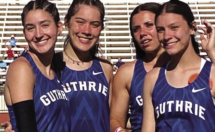Guthrie High track athletes, from left, Cora Leach, Madi Brooks, Haley Gallo and Jackie Howell, celebrate after winning a Class 5A state championship in the 4x400-meter relay at the state track meet in Oklahoma City on May 17. Photo by Michael Kinney.