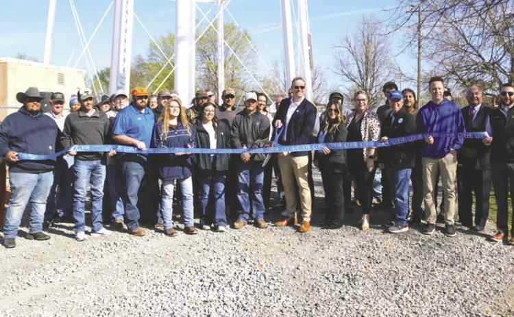 Guthrie community members and officials marked the completion of a new booster pump station at a ribbon cutting ceremony on March 23.