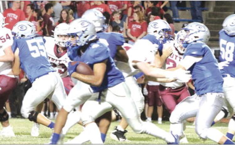 Jaylen Harper behind his offensive line. Photos by Mike Monahan