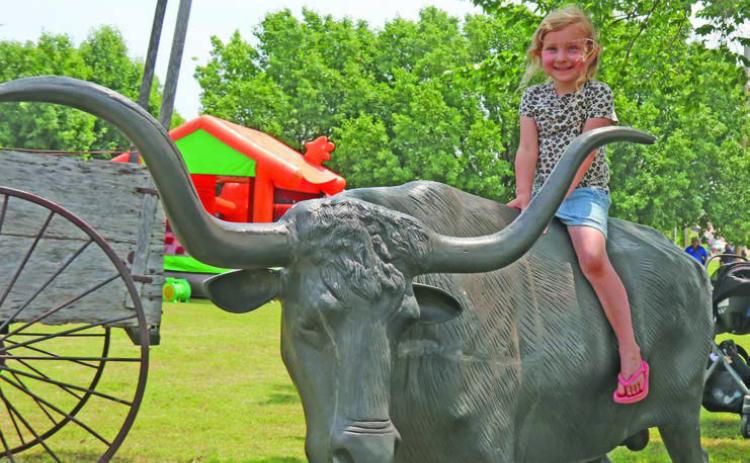 Mesa Harman enjoys the Longhorn Steer at Mulhall Days.