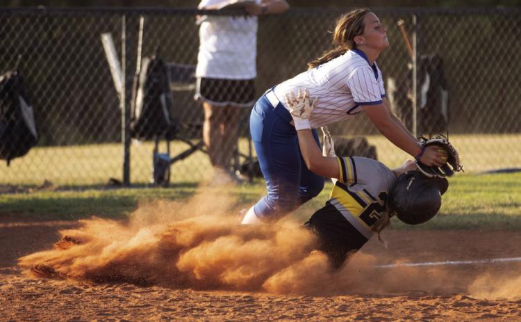 Mulhall-Orlando’s Cassidy Williams, No. 22, makes an aggressive slide into the base as a Coyle defender the tag during the Panthers’ game against Coyle. Photo by Brent Fuchs
