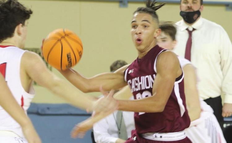 Raney drives to the basket. Photos by Mike Monahan
