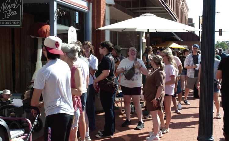 Fans of Gilmore Girls line up outside A Novel Idea Bookshop during Guthrie’s Stars Hollow Fall Celebration, which brought an estimated 2,000 visitors to downtown. Photo by Nikki Bos