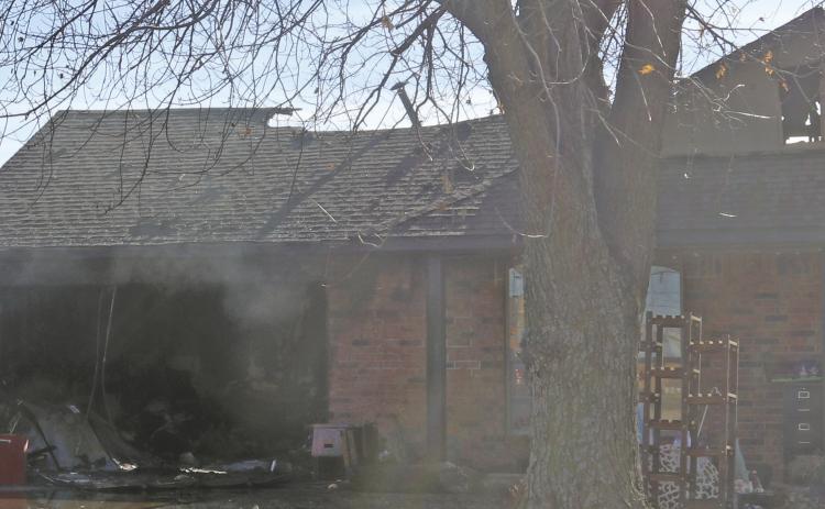 An early Monday morning fire in the 1700 block of Ken Drive caused extensive damage to the house. The fire was called in around 3:30 a.m. and required assistance from Oak Cliff and Sooner Fire Departments. The roof collapsed on the back of the house. The cause of the fire is still under investigation. Photo by Mike Monahan