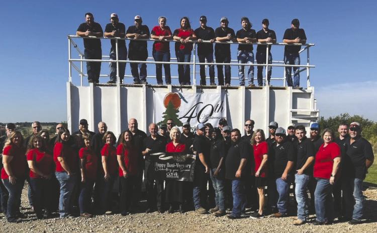 Employees and leadership of Environmental Management Inc. (EMI) gathered in Guthrie in 2023 to celebrate the company’s 40th anniversary. Photo courtesy of EMI.