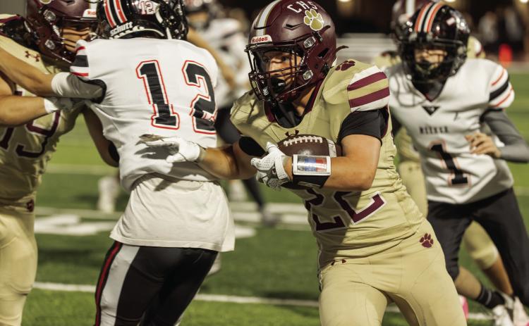 Kiptyn Baker runs with the ball during Cashion’s 54-13 win over Meeker in Cashion, Oklahoma on Friday, Oct. 2. Photo by Brent Fuchs